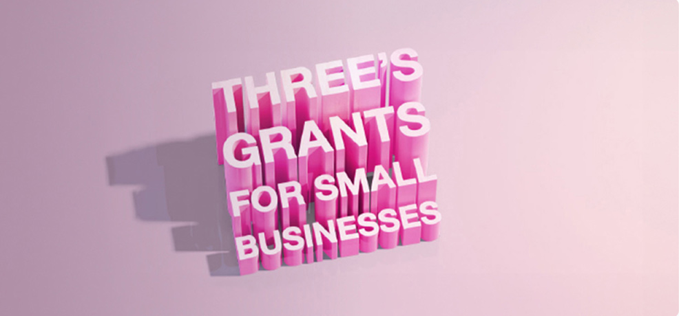 Graphic with pink background and darker pink wording saying Three's Grants for small businesses
