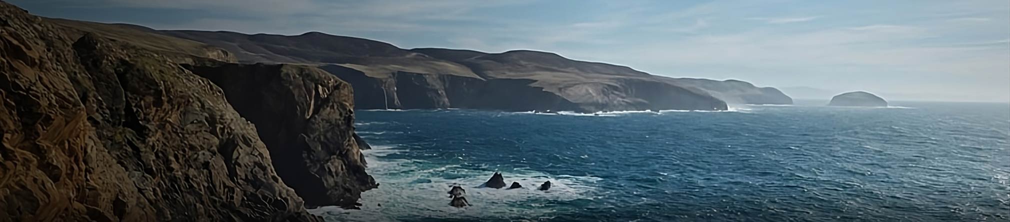 Panoramic image of the arronmore coastline, highlighting the stunning cliffs and vibrant ocean waves.